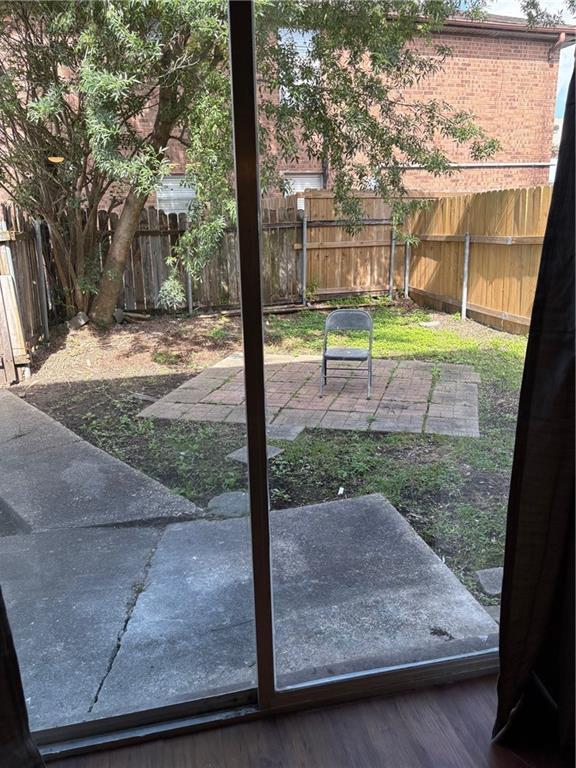 220002 Division St, Metairie, LA 70001 - doorway with wood finished floors