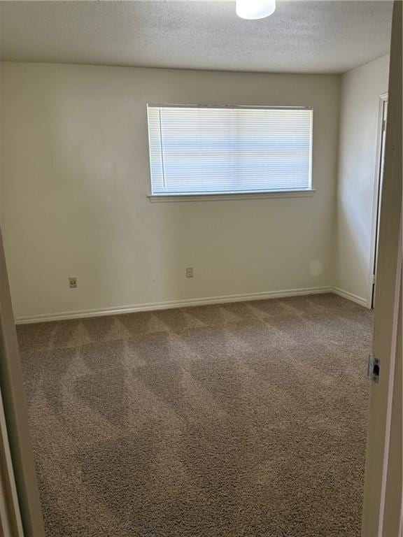 220002 Division St, Metairie, LA 70001 - unfurnished room with baseboards, carpet flooring, and a textured ceiling
