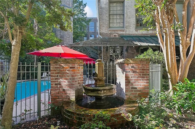 view of patio featuring fence and a fenced in pool