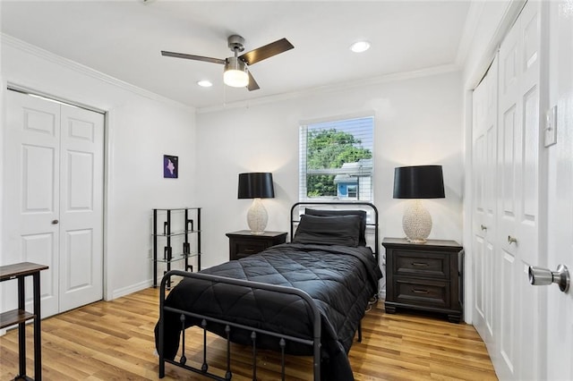bedroom featuring crown molding, baseboards, recessed lighting, a ceiling fan, and light wood finished floors