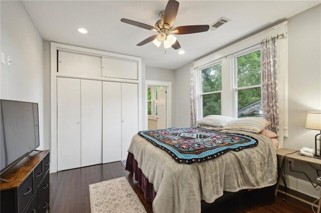 bedroom featuring a ceiling fan, a closet, recessed lighting, and dark wood-type flooring