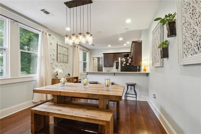 dining room featuring recessed lighting, baseboards, visible vents, and dark wood-style floors