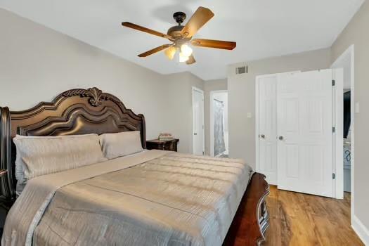 3320 Timberlane Way Dr Unit 134, Harvey, LA 70058 - bedroom featuring ceiling fan, visible vents, and wood finished floors