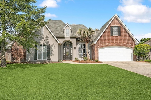 864 Sweet Bay Dr, Mandeville, LA 70448 - view of front of home featuring driveway, a front yard, a garage, and brick siding