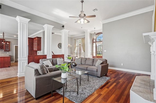 864 Sweet Bay Dr, Mandeville, LA 70448 - living room featuring a ceiling fan, ornate columns, wood-type flooring, crown molding, and recessed lighting