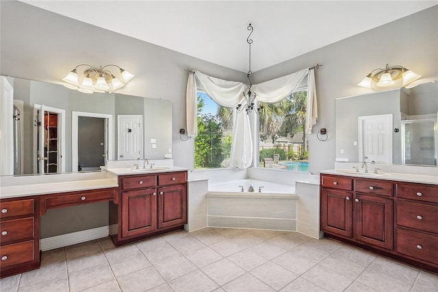 864 Sweet Bay Dr, Mandeville, LA 70448 - bathroom with tile patterned floors, a garden tub, two vanities, and a stall shower