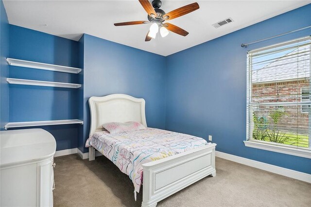 864 Sweet Bay Dr, Mandeville, LA 70448 - carpeted bedroom featuring multiple windows, baseboards, and a ceiling fan