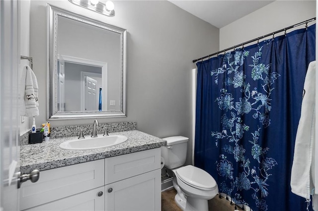 full bathroom with vanity, a shower with curtain, and toilet