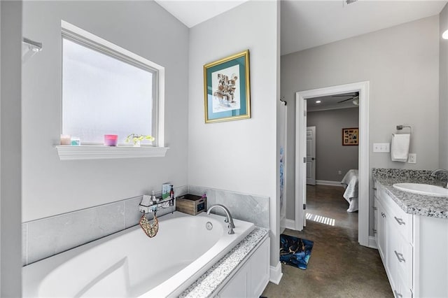 full bathroom with vanity, baseboards, and a garden tub