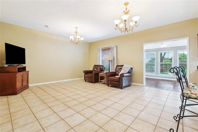living area with an inviting chandelier, baseboards, and light tile patterned flooring