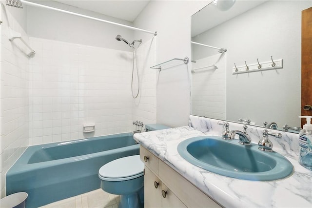 full bathroom with vanity, tile patterned floors, toilet, and shower / washtub combination
