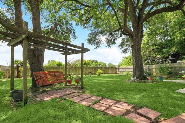 view of yard featuring a fenced backyard and a pergola