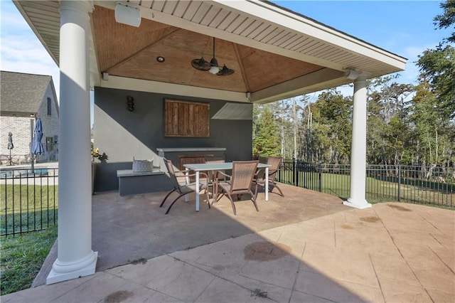 413 Dockside Dr, Slidell, LA 70461 - view of patio with fence, a ceiling fan, outdoor dining space, and a gazebo