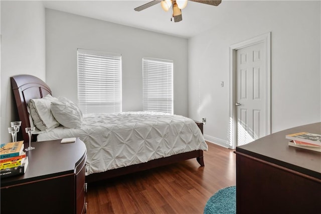 413 Dockside Dr, Slidell, LA 70461 - bedroom with dark wood-style flooring, ceiling fan, and baseboards