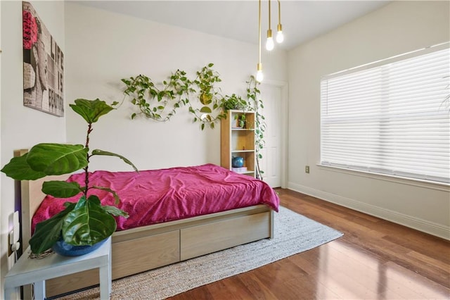 413 Dockside Dr, Slidell, LA 70461 - bedroom with baseboards and wood finished floors