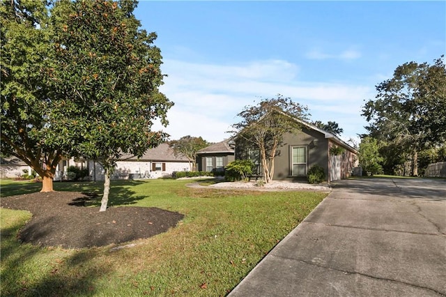 413 Dockside Dr, Slidell, LA 70461 - view of front of house with a front lawn and concrete driveway