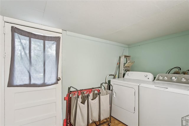 washroom featuring laundry area and washing machine and dryer