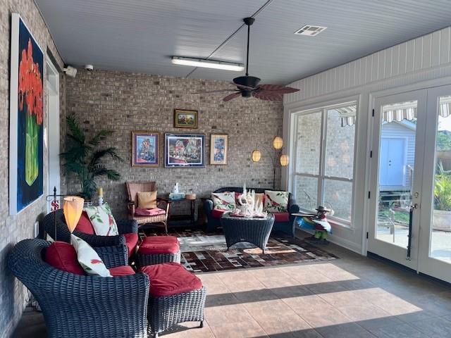 interior space with visible vents, ceiling fan, outdoor lounge area, tile patterned floors, and french doors