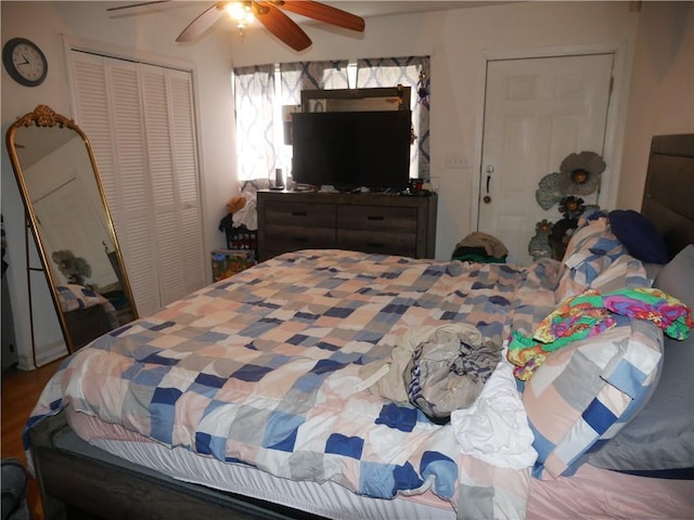 bedroom featuring ceiling fan and a closet