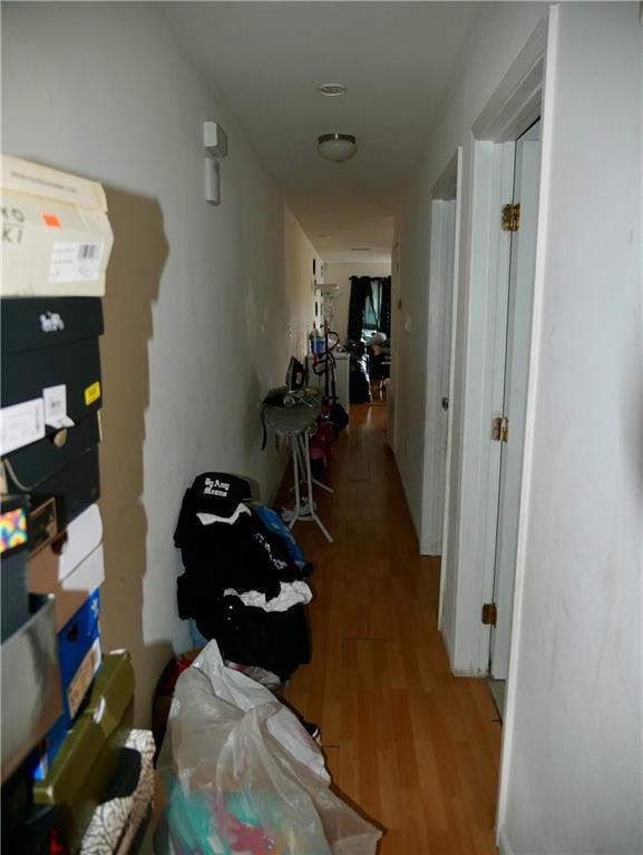 corridor with light wood-style flooring