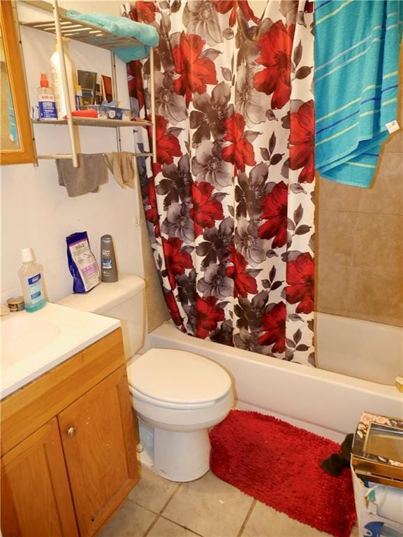 full bathroom featuring tile patterned floors, vanity, toilet, and shower / tub combo