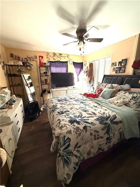 bedroom with dark wood-style flooring and ceiling fan