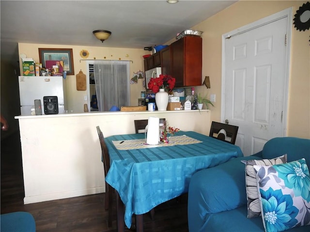 dining space featuring wood finished floors