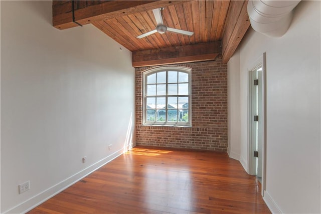 unfurnished room with baseboards, wood ceiling, wood finished floors, and beamed ceiling