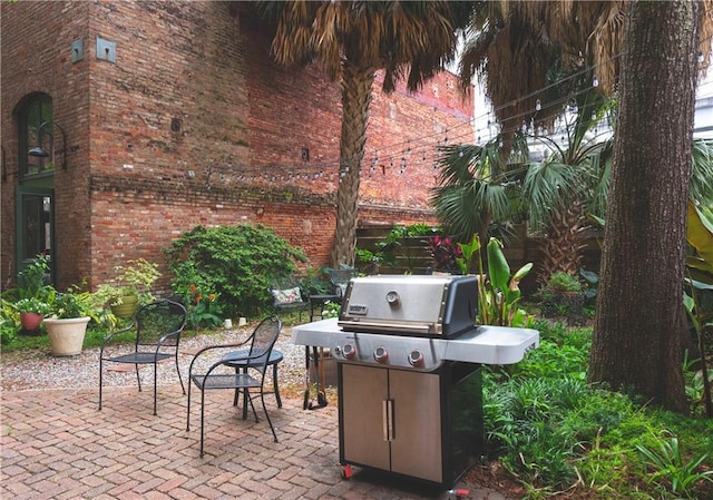 view of patio featuring a grill