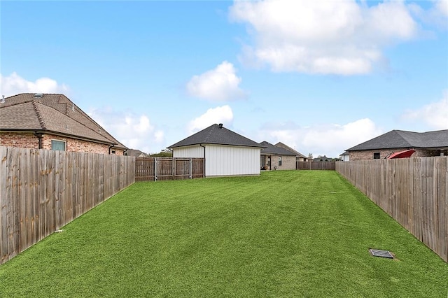 view of yard featuring a fenced backyard