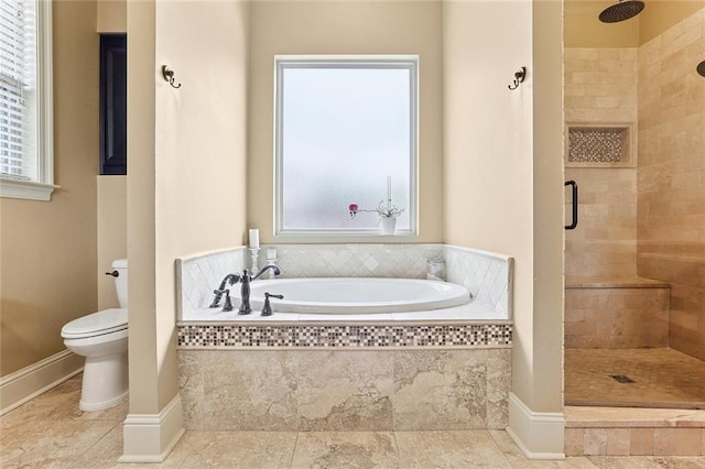 full bath with a garden tub, a shower stall, tile patterned floors, baseboards, and toilet