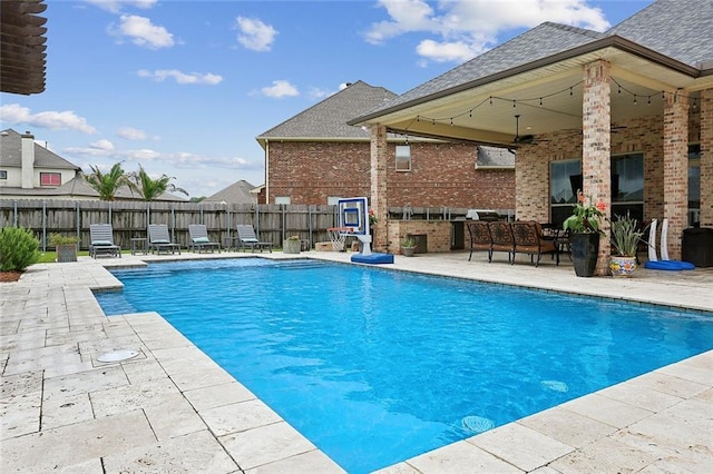 view of pool with fence, a fenced in pool, and a patio area