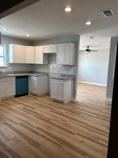 340 Azalea Dr, Waggaman, LA 70094 - kitchen featuring dishwasher, light wood-style floors, ceiling fan, baseboards, and decorative backsplash