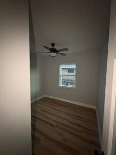 unfurnished room featuring baseboards, a ceiling fan, and wood finished floors