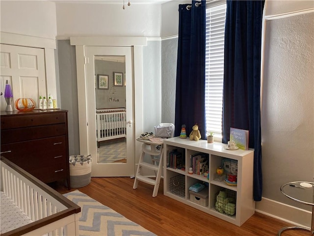 bedroom featuring wood finished floors