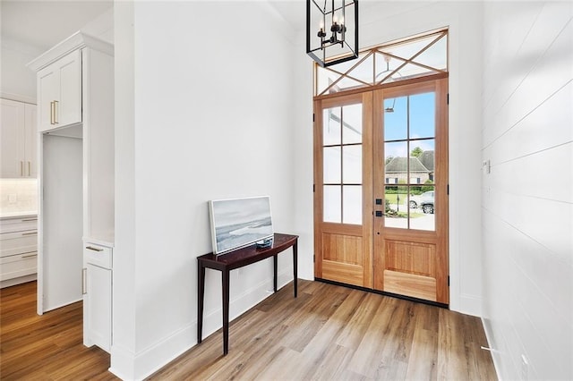 301 Cypress Lakes Dr, Slidell, LA 70458 - doorway to outside featuring an inviting chandelier and light wood finished floors