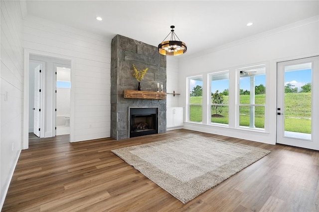 301 Cypress Lakes Dr, Slidell, LA 70458 - unfurnished living room featuring a fireplace, recessed lighting, wood finished floors, and a wealth of natural light