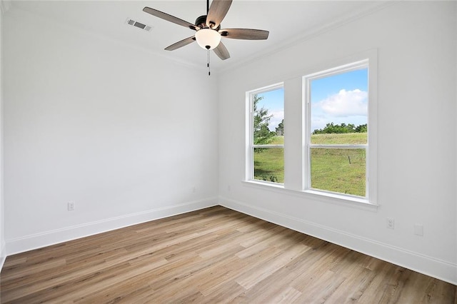 301 Cypress Lakes Dr, Slidell, LA 70458 - spare room featuring visible vents, ornamental molding, baseboards, and light wood-type flooring