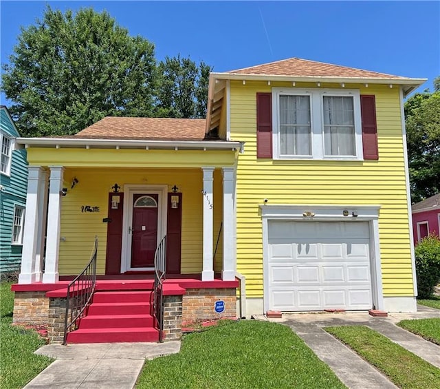 split level home featuring an attached garage, roof with shingles, and a porch