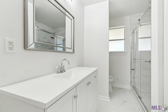 bathroom featuring toilet, baseboards, marble finish floor, and a stall shower