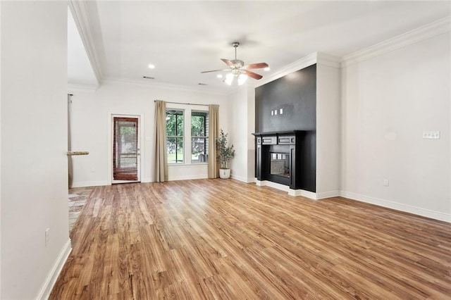61267 Forest Dr, Lacombe, LA 70445 - unfurnished living room with crown molding, a ceiling fan, baseboards, and light wood-type flooring