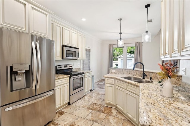 61267 Forest Dr, Lacombe, LA 70445 - kitchen with cream cabinets, crown molding, appliances with stainless steel finishes, a sink, and stone tile flooring