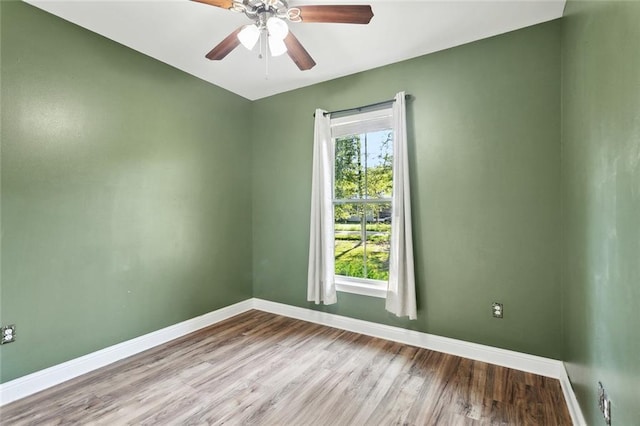 61267 Forest Dr, Lacombe, LA 70445 - unfurnished room with a ceiling fan, baseboards, and wood finished floors