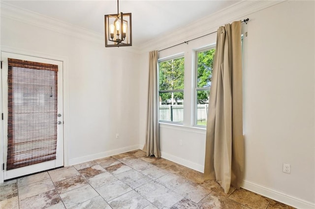 61267 Forest Dr, Lacombe, LA 70445 - interior space featuring crown molding, baseboards, an inviting chandelier, and stone finish floor