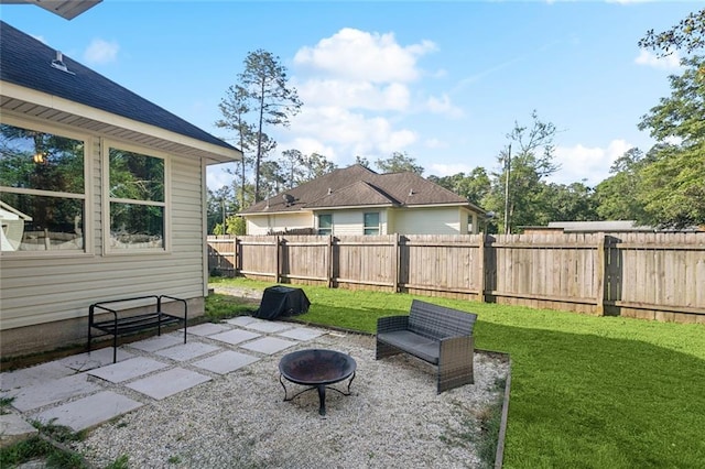 61267 Forest Dr, Lacombe, LA 70445 - view of patio / terrace with a fire pit and a fenced backyard