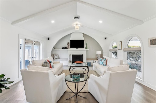 4524 Folse Dr, Metairie, LA 70006 - living area featuring visible vents, plenty of natural light, wood finished floors, and a fireplace