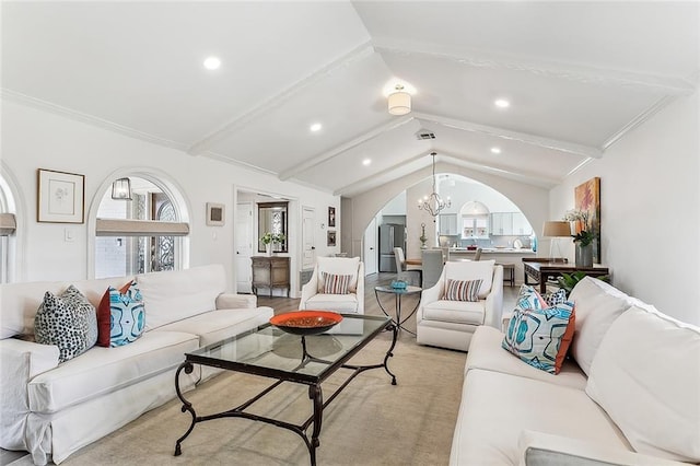 4524 Folse Dr, Metairie, LA 70006 - living area featuring vaulted ceiling with beams, arched walkways, a notable chandelier, and recessed lighting
