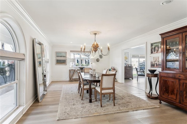 4524 Folse Dr, Metairie, LA 70006 - dining space with light wood-type flooring, baseboards, a chandelier, ornamental molding, and recessed lighting
