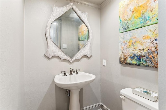 4524 Folse Dr, Metairie, LA 70006 - bathroom featuring baseboards, ornamental molding, and toilet