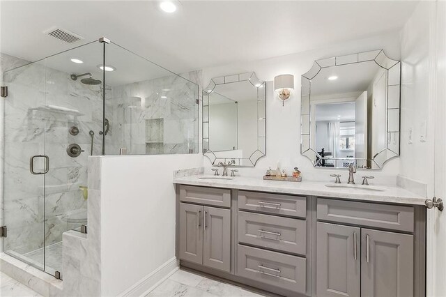 4524 Folse Dr, Metairie, LA 70006 - bathroom featuring visible vents, a sink, marble finish floor, and a marble finish shower